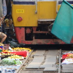 the canopy is pulled back and the market quickly moved so the train can pass